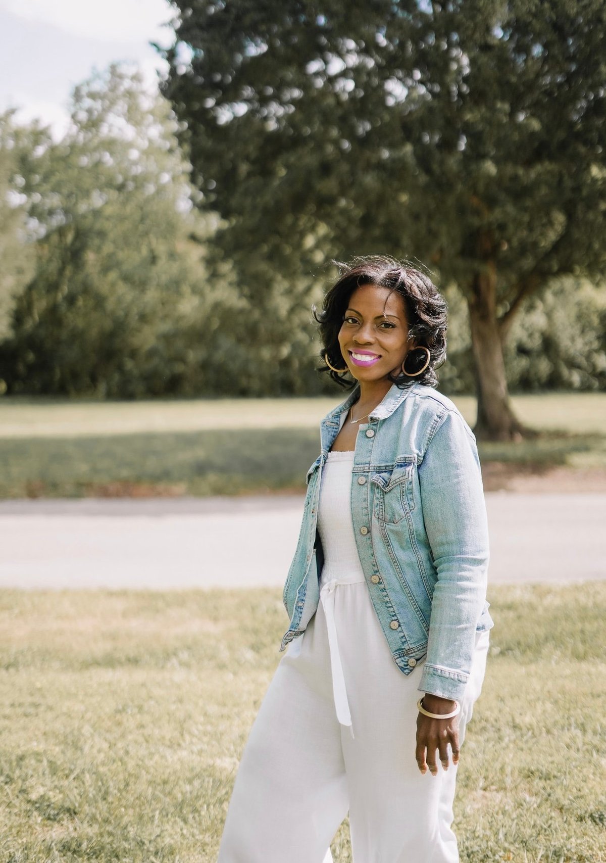 Tiffany L. Clark - Founder of Long Hair We Care wearing denim jacket outdoors
